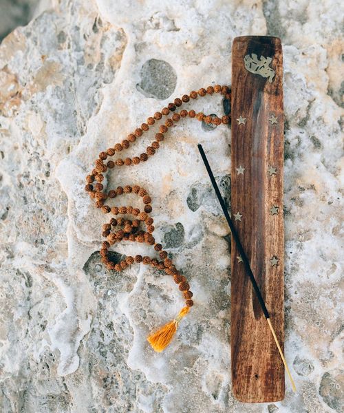 Abstract silhouette of a person in a meditative posture.